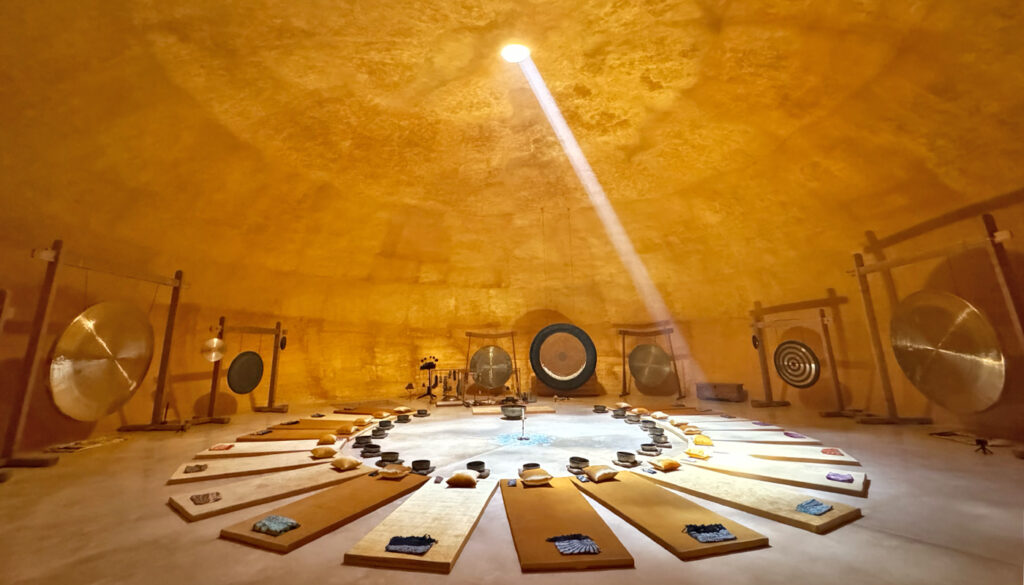 The Quantum Sound Dome at Udara Bali in Seseh, set up for a sound healing ceremony with gongs and singing bowls arranged in a circle