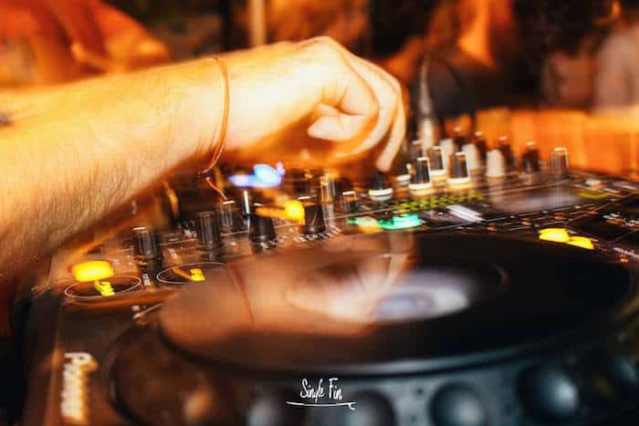 A DJ hitting the decks at Single Fin Bali