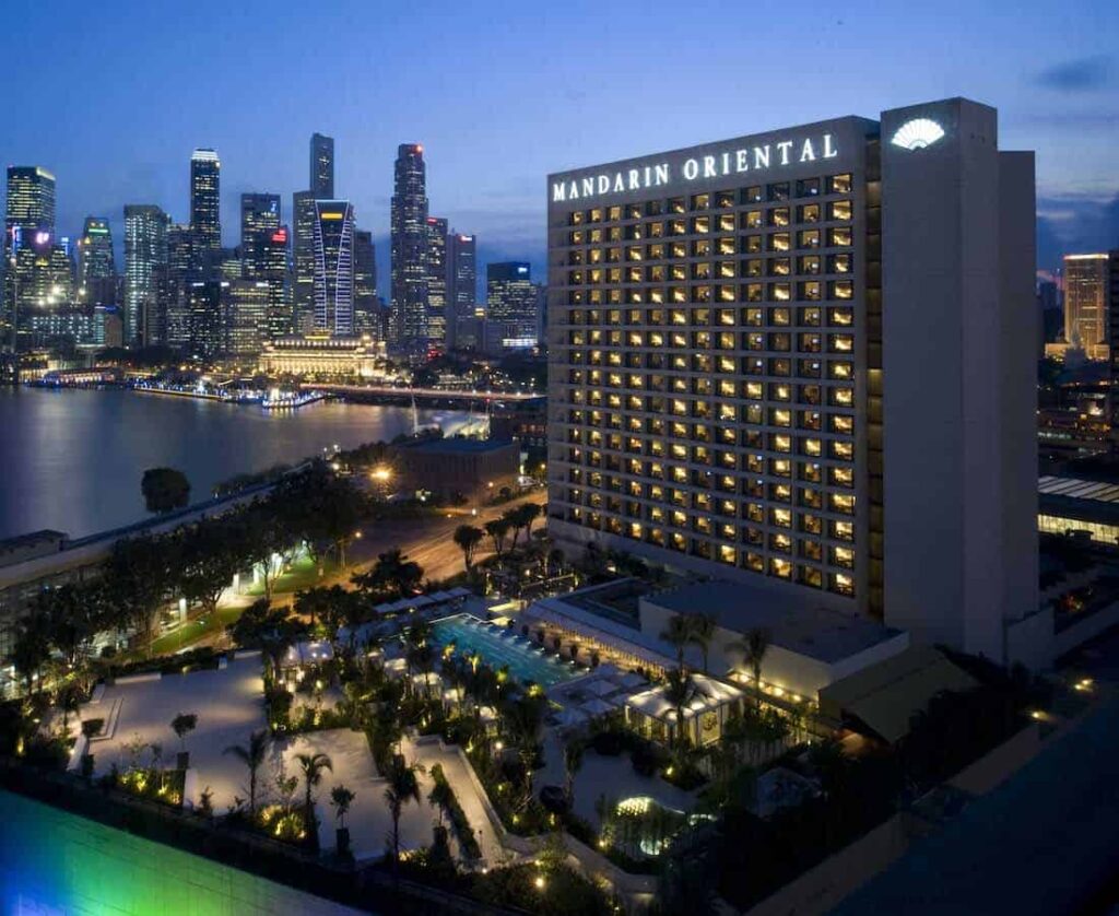 Building façade of Mandarin Oriental Singapore Hotel in the evening