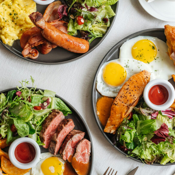 Brunch Orchard Road: hearty breakfast plates with sunny-side eggs, steak, salmon, sausages, salad and coffee.