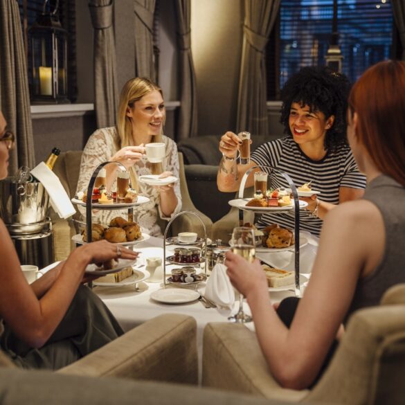 four women having high teas together