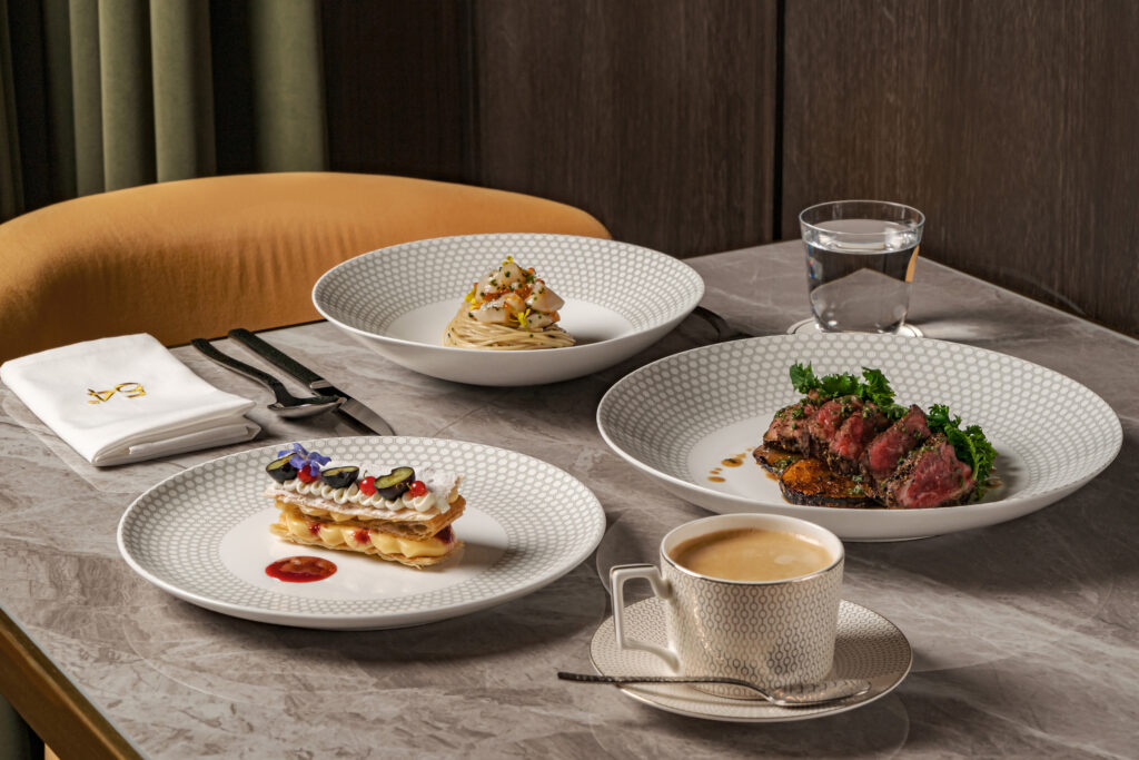 Three-course set lunch spread at 54° Steakhouse on Amoy Street, Singapore, featuring a pasta dish, sliced steak and a mille-feuille dessert with coffee