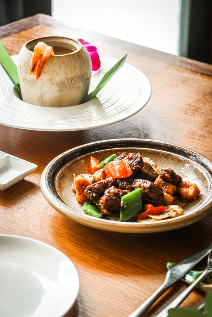 Seared Angus Beef Tenderloin Cubes and double-boiled soup served in a young coconut at Empress restaurant, Asian Civilisations Museum, Singapore