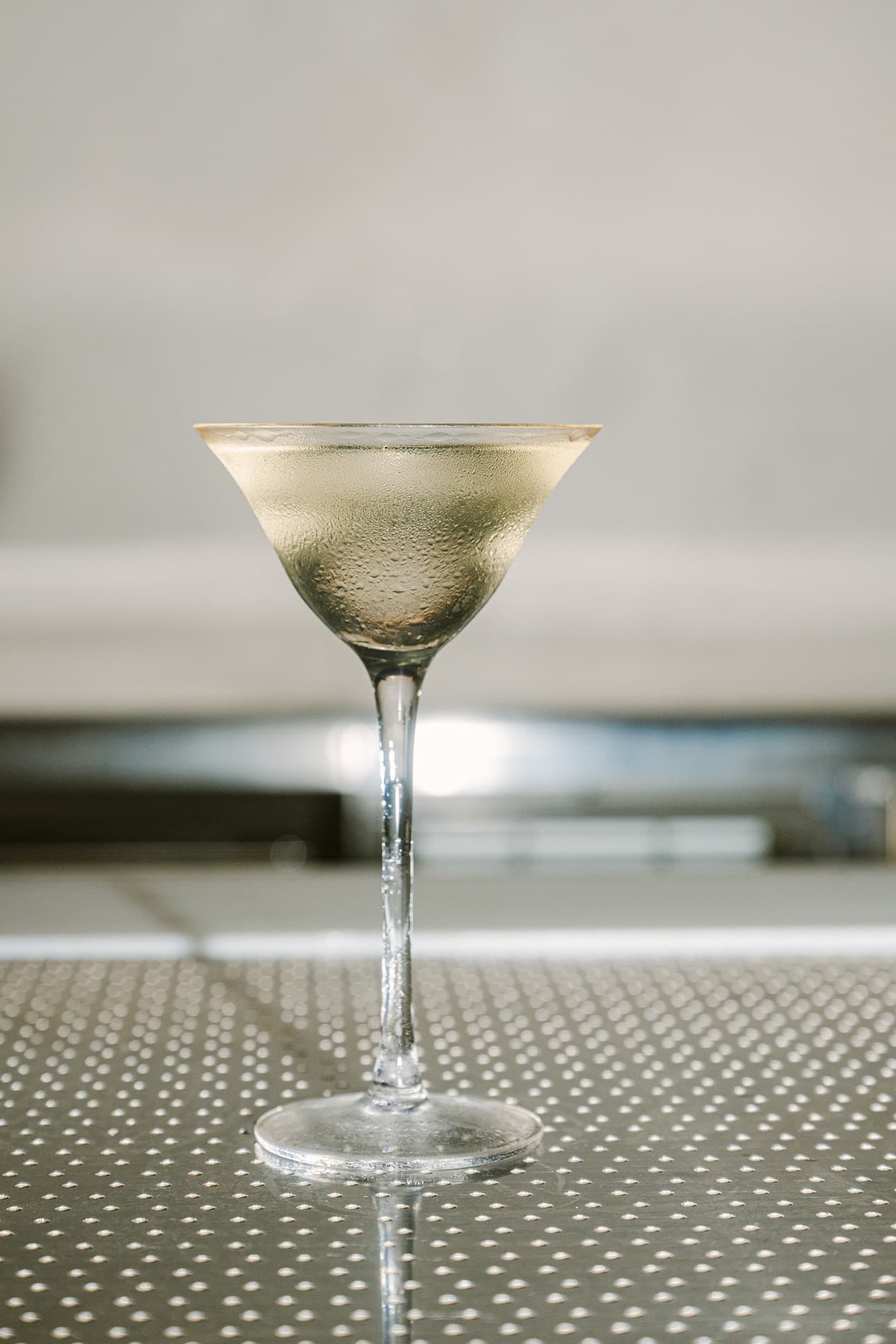 Jellyfish Martini cocktail at FURA Singapore, served chilled in a frosted glass with a translucent finish — known for avant-garde drinks with a sustainable and marine-themed twist.