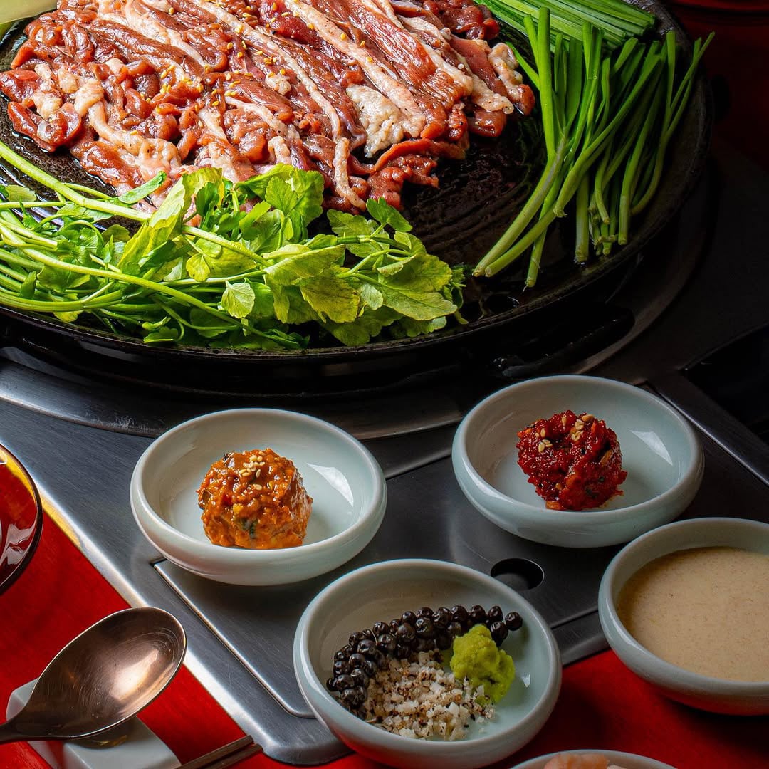 Korean vintage BBQ spread with grilled duck and assorted dipping sauces at Sodeng, Telok Ayer’s duck BBQ destination.