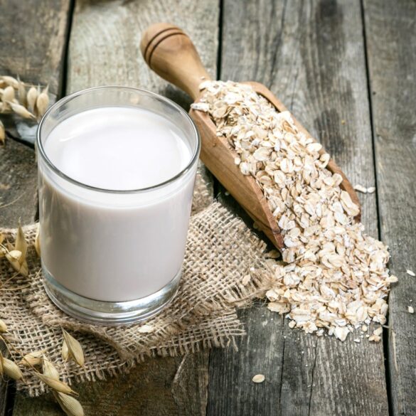 oats and oat milk on a wooden table
