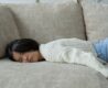 young asian girl sleeping on the couch