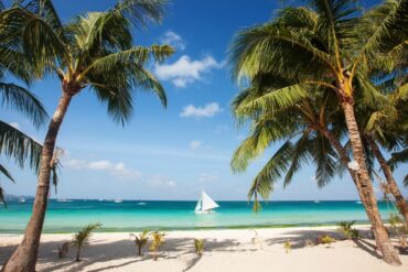 a photo of the pristine white sand beaches of boracay island in philippines