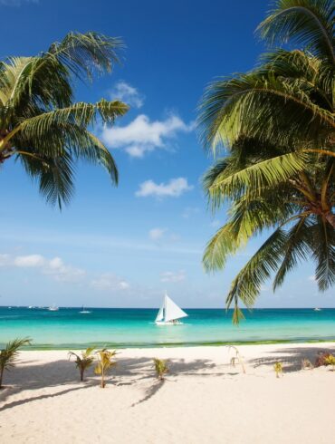 a photo of the pristine white sand beaches of boracay island in philippines