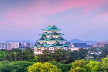 a photo of nagoya castle and the city skyline