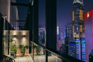 an image of the skyscraper view from the suite at the hari hong kong in wanchai
