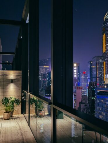 an image of the skyscraper view from the suite at the hari hong kong in wanchai