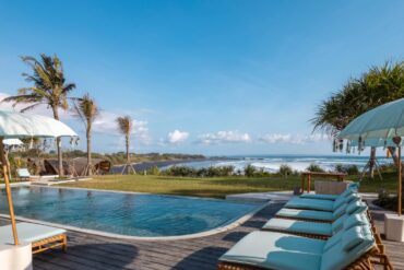 an image of the pool view at oshom bali overlooking the ocean