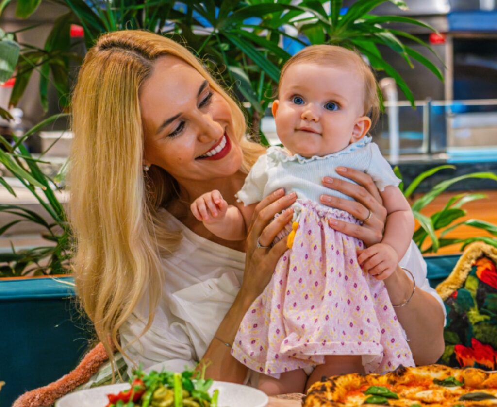 Caucasian mother and her baby at Publico Ristorante & Garden, InterContinental Singapore Robertson Quay