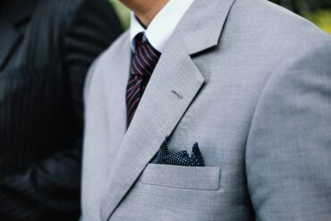 A man in a ligh grey suit