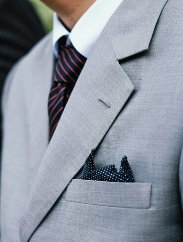 A man in a ligh grey suit