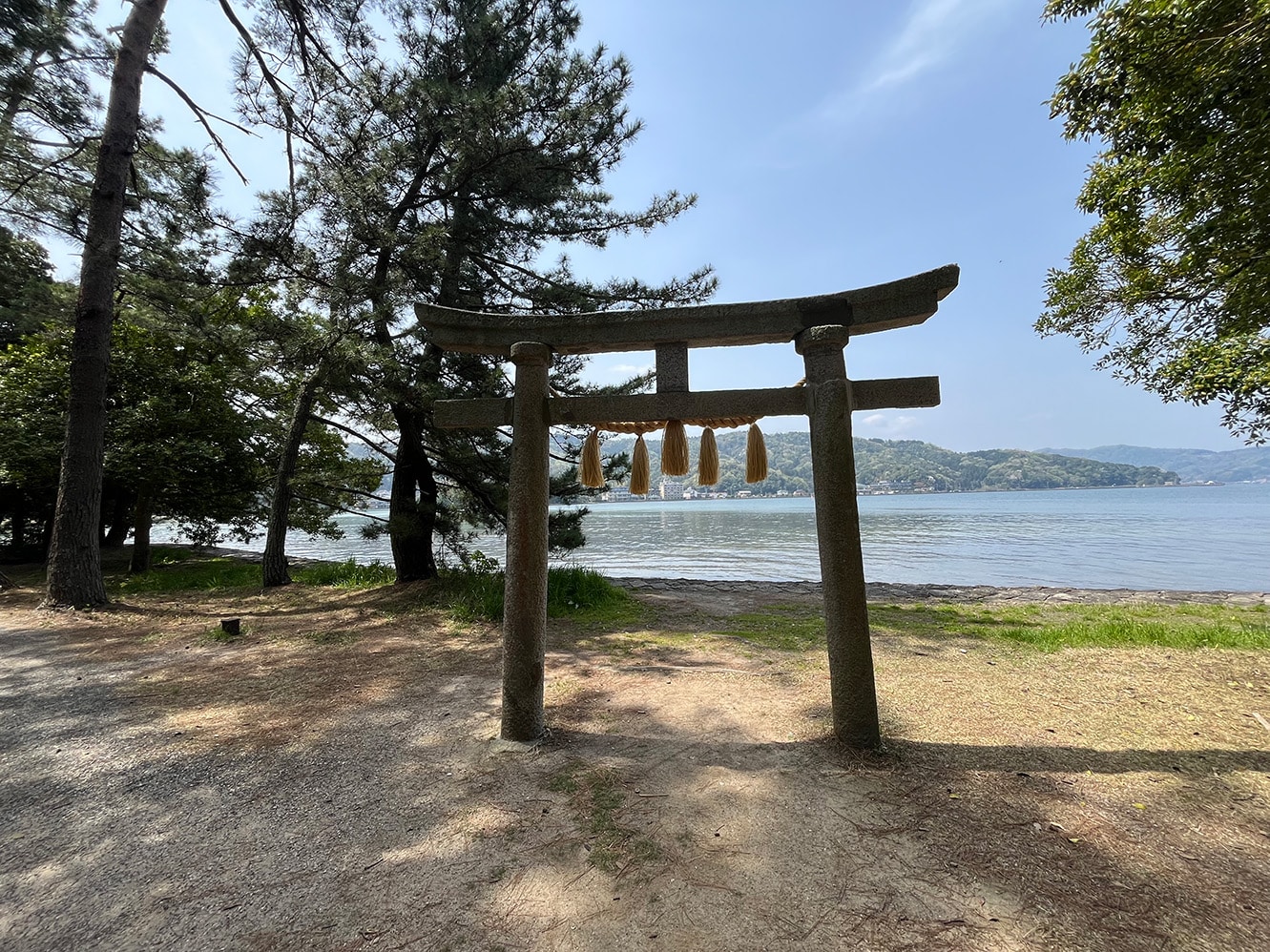 Lone torii gate at Asoumi-gawa facing the sea on Amanohashidate sandbar, Miyazu, Kyoto, Japan.