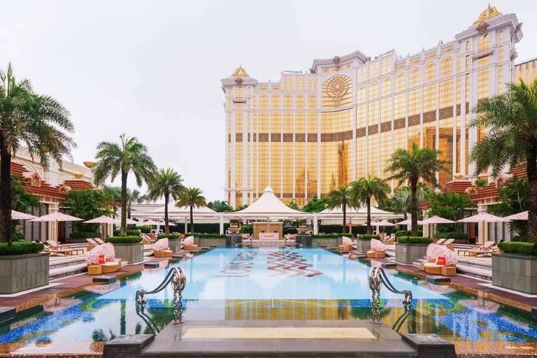 A display of Banyan Tree Macau’s cabanas and Mandarin Oriental’s hotel building and a cocktail at Vida Rica Bar