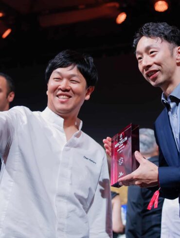 Chefs celebrating with a selfie after receiving Michelin star awards at the Michelin Guide Singapore 2025 ceremony, marking achievements in Singapore’s fine dining scene.