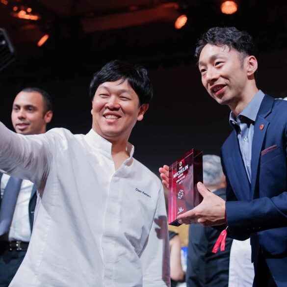 Chefs celebrating with a selfie after receiving Michelin star awards at the Michelin Guide Singapore 2025 ceremony, marking achievements in Singapore’s fine dining scene.