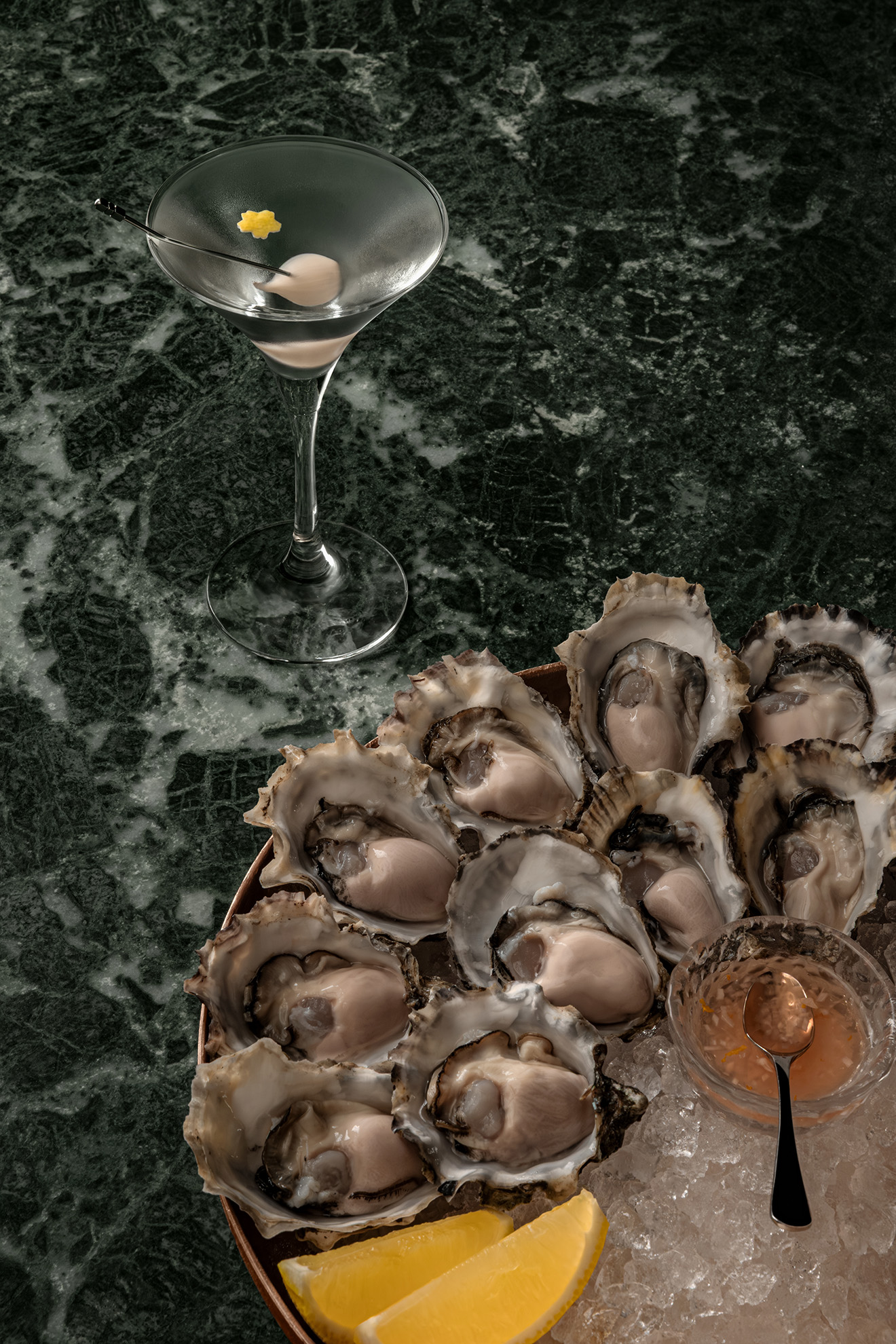 Gibson cocktail served at –15°C with fresh oysters on ice, part of Gibson Bar’s TIMELESS 10th anniversary cocktail menu in Singapore.