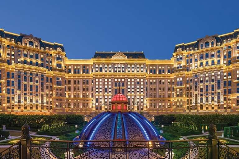 Iconic three towers of Grand Lisboa Palace Macau showcasing its luxurious hotel architecture and a guest room view
