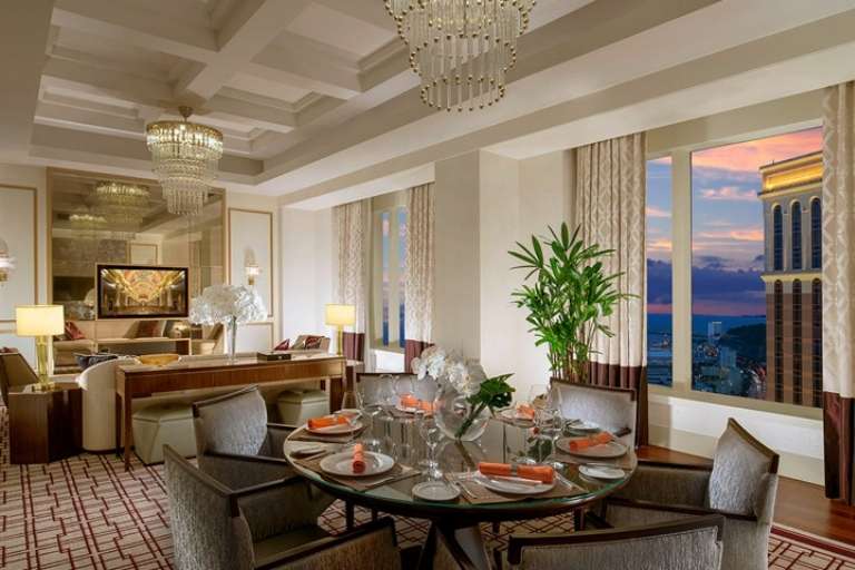  Interior view of The Venetian Macao's Milano Suite, showing the elegant separate living and bedroom areas