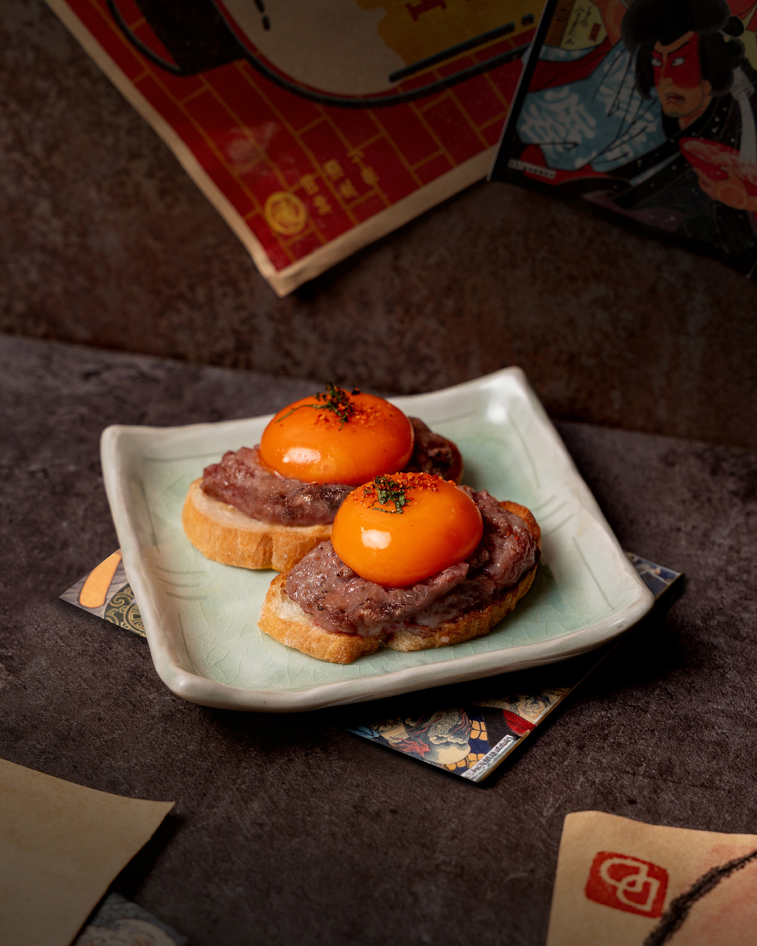 Signature A4 Wagyu Baguette topped with cured egg yolk at Uoharu Singapore, part of its one-year anniversary limited-time izakaya menu.