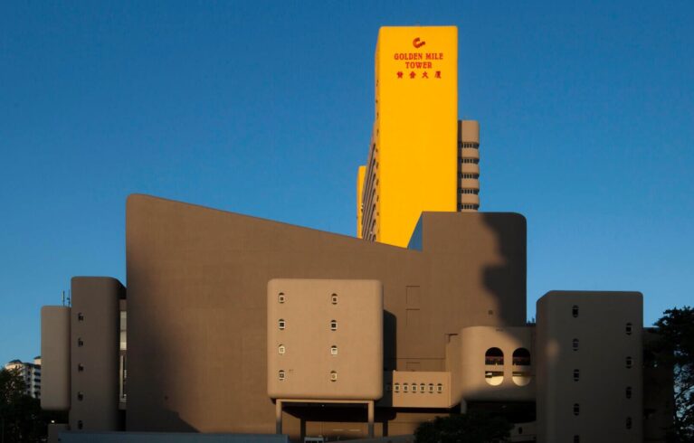 the golden mile tower building against a clear blue sky