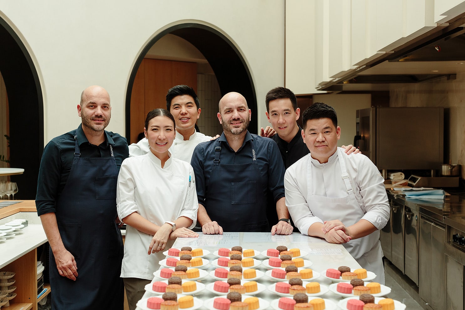 Asia’s top chefs behind dearGENTLEFOLK’s Harvest of Happiness mooncake collaboration, including Chef Zor Tan, Chef Pam, Chef Ton, Chefs Sühring, and Chef Dej Kewkacha, pictured with the mooncake creations.