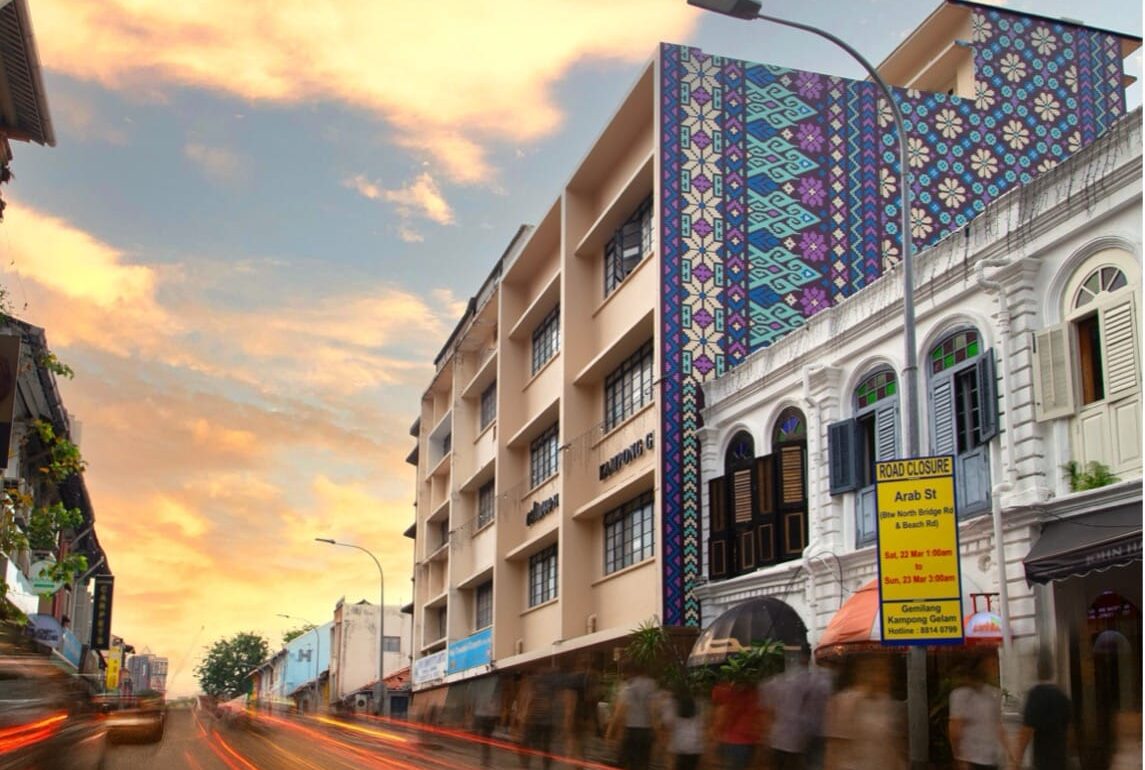 Exterior view of Coliwoo Hotel Kampong Glam in Singapore, featuring geometric facade inspired by traditional Malay textile patterns