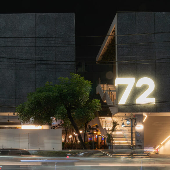 Night view of the modern concrete façade and illuminated “72” signage of 72 Courtyard Bangkok, a lifestyle and nightlife destination in Thonglor Thailand.