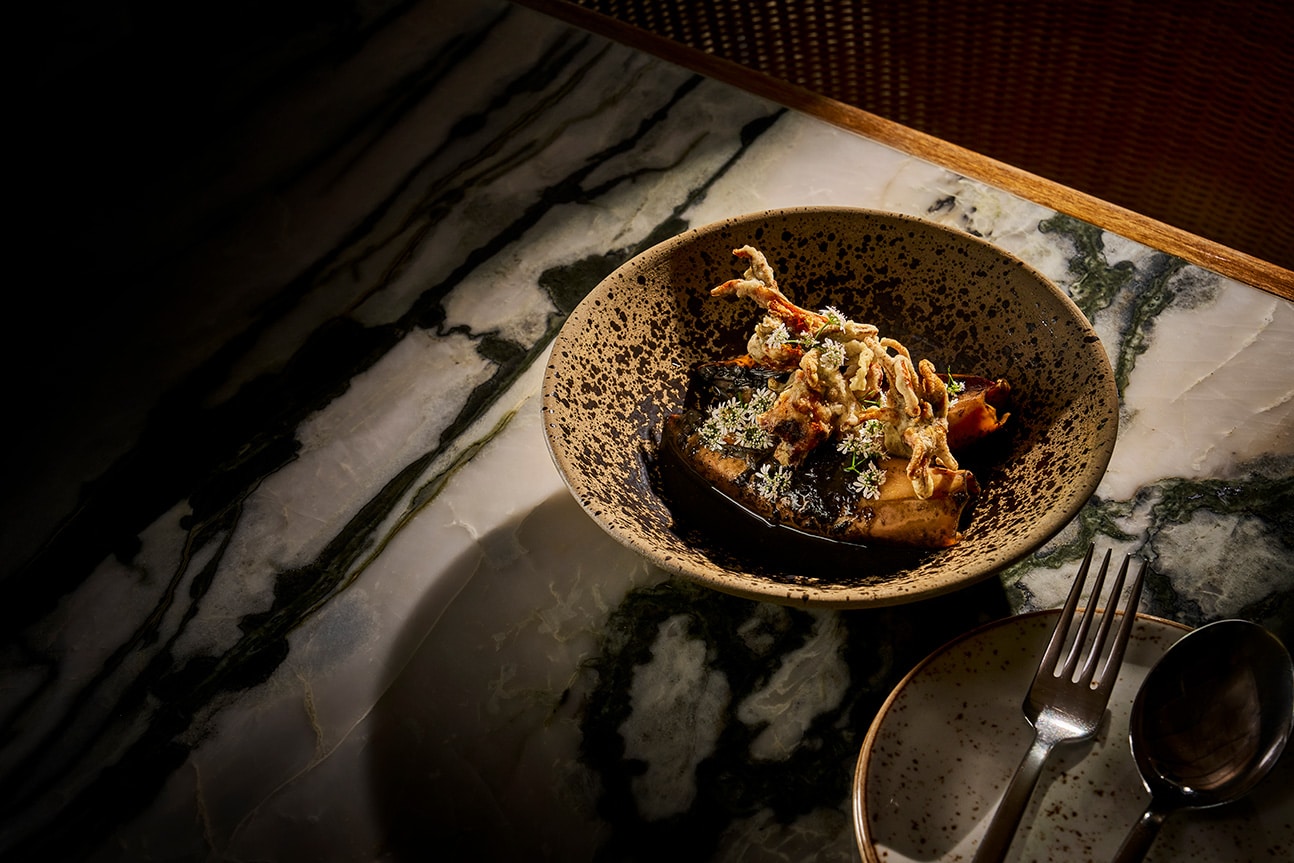 Peranakan-style Sotong Masak Hitam at Po, The Warehouse Hotel – squid in rich black ink sauce with crispy tentacles.