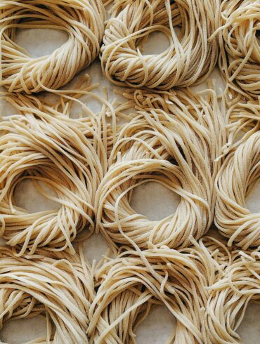 Fresh handmade noodles on a baking sheet