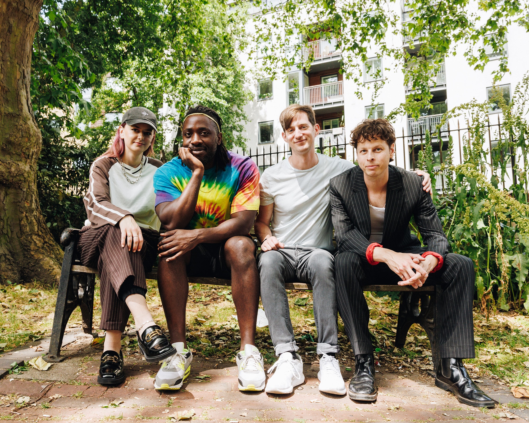 Bloc Party band photographed outdoors ahead of their Clockenflap 2025 Hong Kong debut, blending indie rock legacy with urban festival vibes.