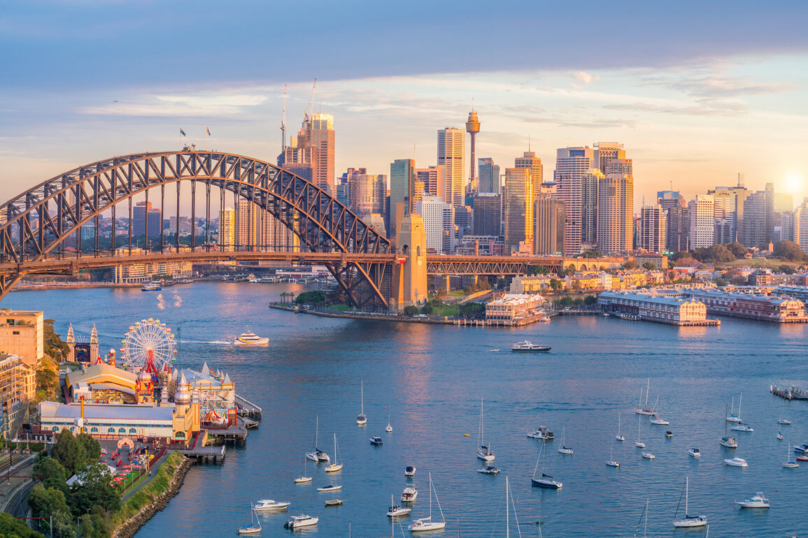 Scenic panoramic view of Melbourne’s modern cityscape with the Yarra River in the foreground, showcasing a blend of contemporary skyscrapers and historic architecture under a clear blue sky. This vibrant snapshot reflects Melbourne's reputation as a cultural and design capital of Australia, perfect for destination marketing and urban exploration features.