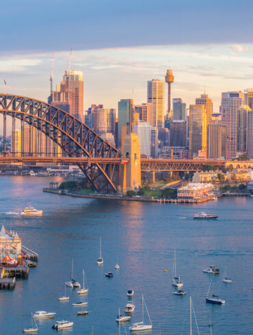 Scenic panoramic view of Melbourne’s modern cityscape with the Yarra River in the foreground, showcasing a blend of contemporary skyscrapers and historic architecture under a clear blue sky. This vibrant snapshot reflects Melbourne's reputation as a cultural and design capital of Australia, perfect for destination marketing and urban exploration features.