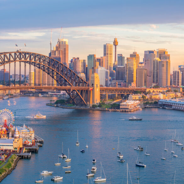 Scenic panoramic view of Melbourne’s modern cityscape with the Yarra River in the foreground, showcasing a blend of contemporary skyscrapers and historic architecture under a clear blue sky. This vibrant snapshot reflects Melbourne's reputation as a cultural and design capital of Australia, perfect for destination marketing and urban exploration features.