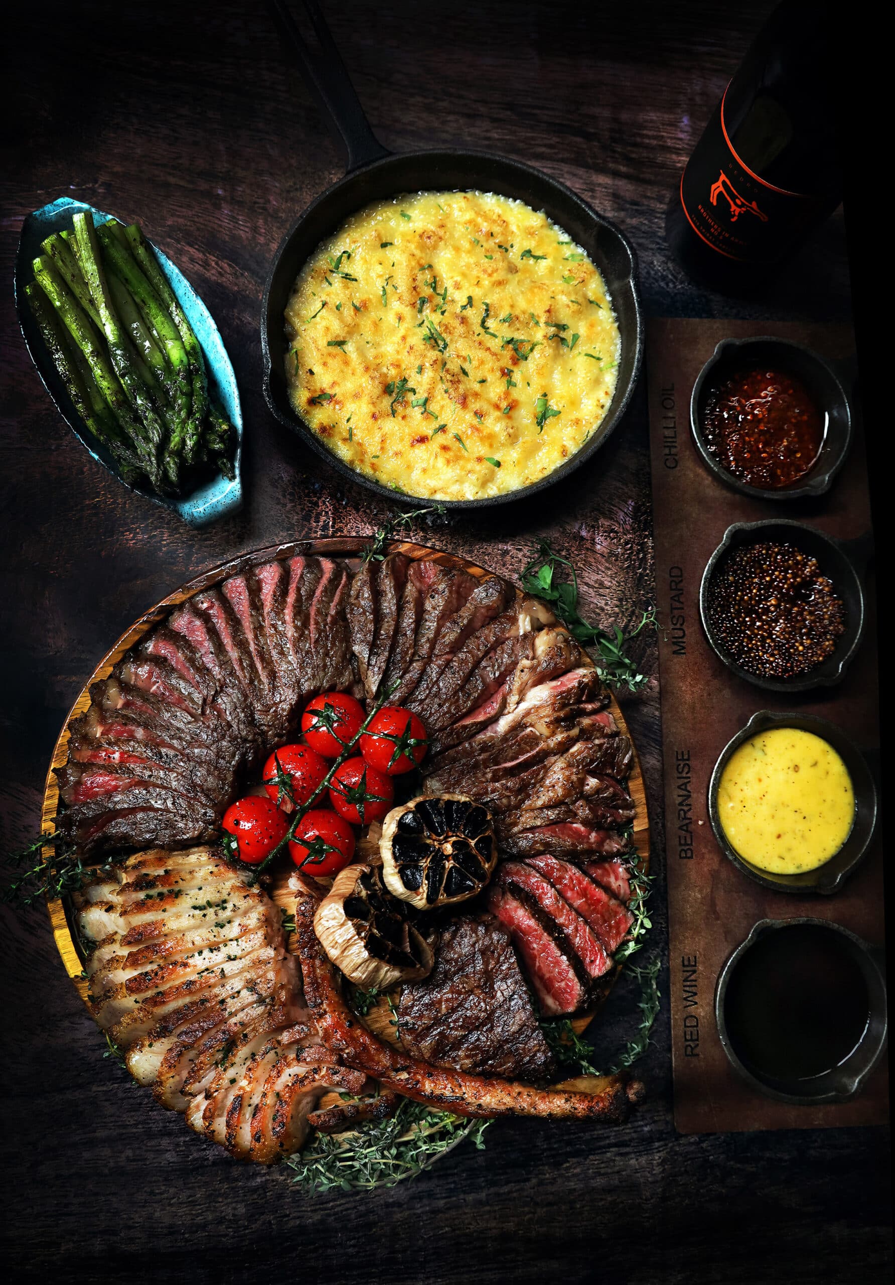 Festive Grandeur Platter at Bedrock Bar & Grill featuring woodfire-grilled meats and classic sides — a hearty Christmas Day lunch in Singapore.