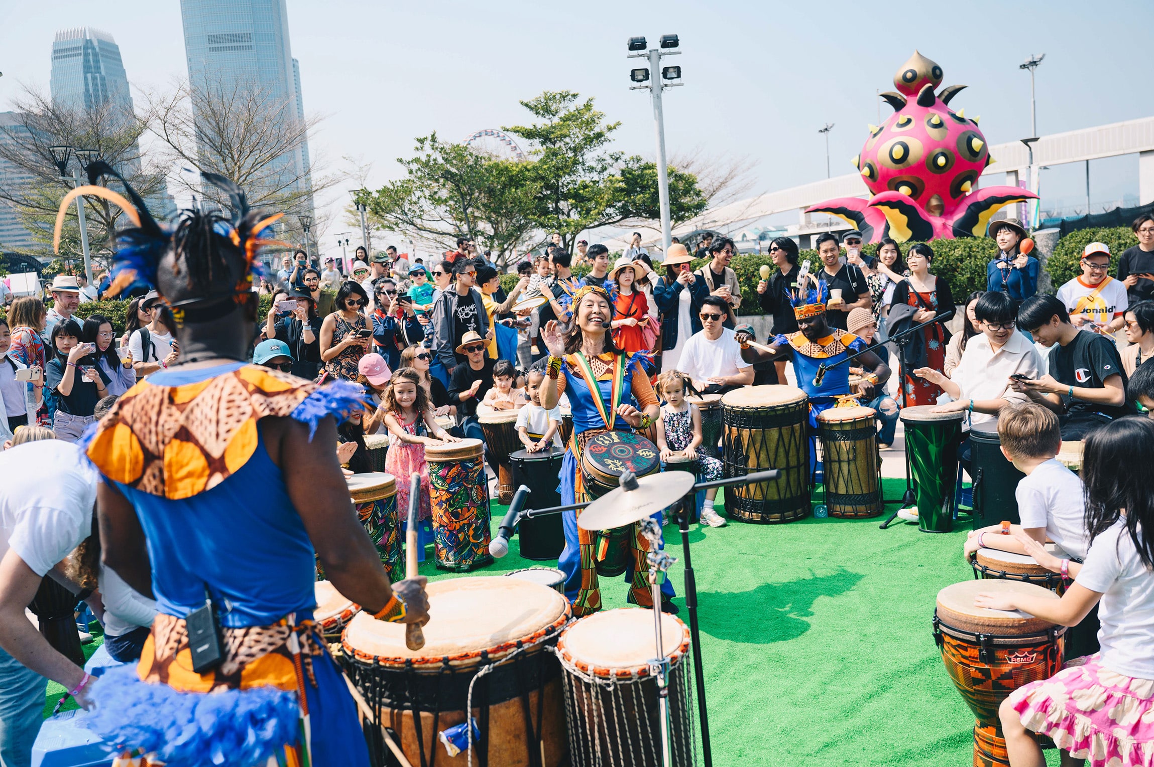 Interactive drumming workshop at Clockenflap 2025, showcasing the festival’s family-friendly programming in Hong Kong’s Central Harbourfront.