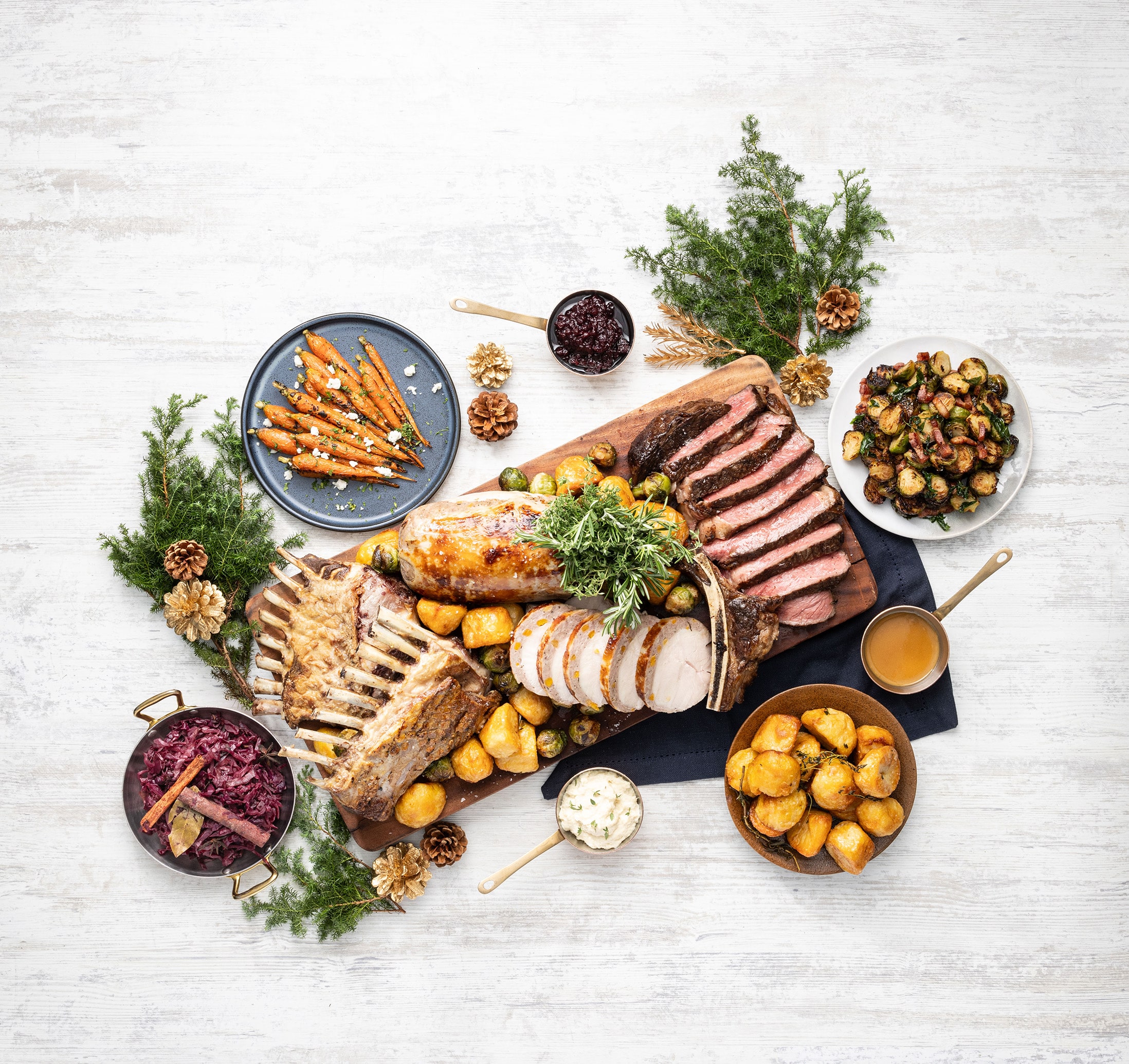 Christmas Day lunch at Artemis Grill, Singapore, with guests enjoying Mediterranean cuisine amidst lush garden terraces and skyline views.