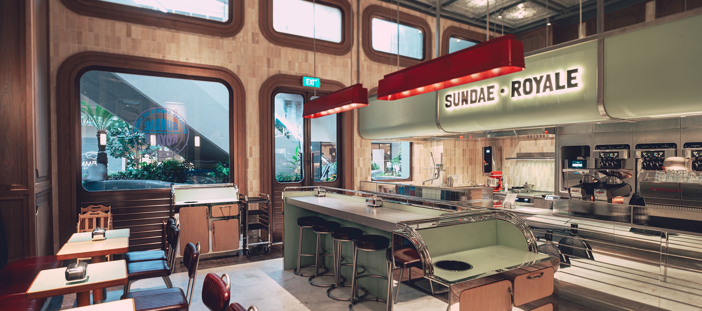Retro-inspired interior of Sundae Royale at Resorts World Sentosa Singapore – soft-serve dessert bar by Chef Paul Pairet with counter seating and vintage charm.