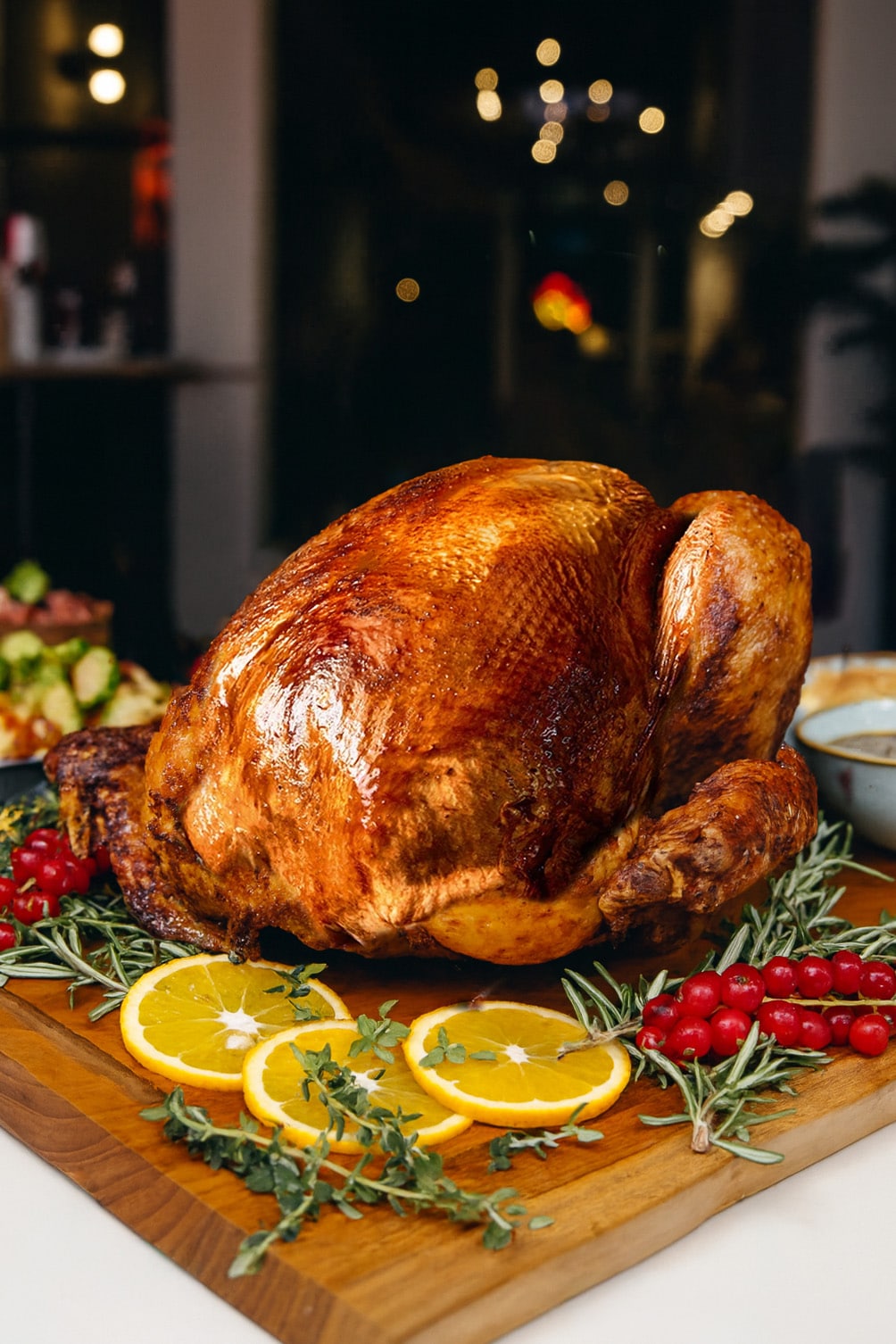 Golden roasted whole turkey garnished with herbs and citrus slices — perfect for festive takeaway or catering for corporate Christmas events in Singapore.