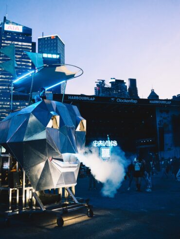 Silent disco installation at Clockenflap 2025 with Hong Kong skyline in view, blending music, urban design, and late-night energy.