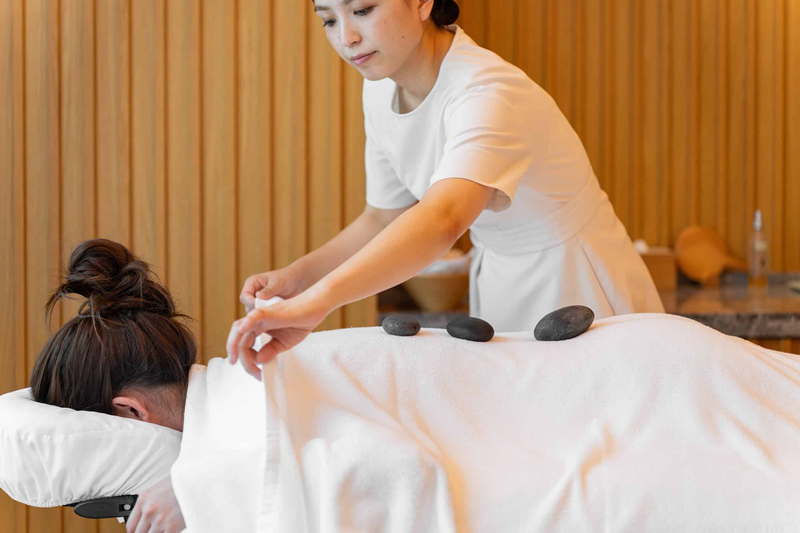 Signature massage in progress at the Heavenly® Spa, The Westin Yokohama – a tranquil space focused on wellness rituals using aromatherapy and White Tea-scented oils.