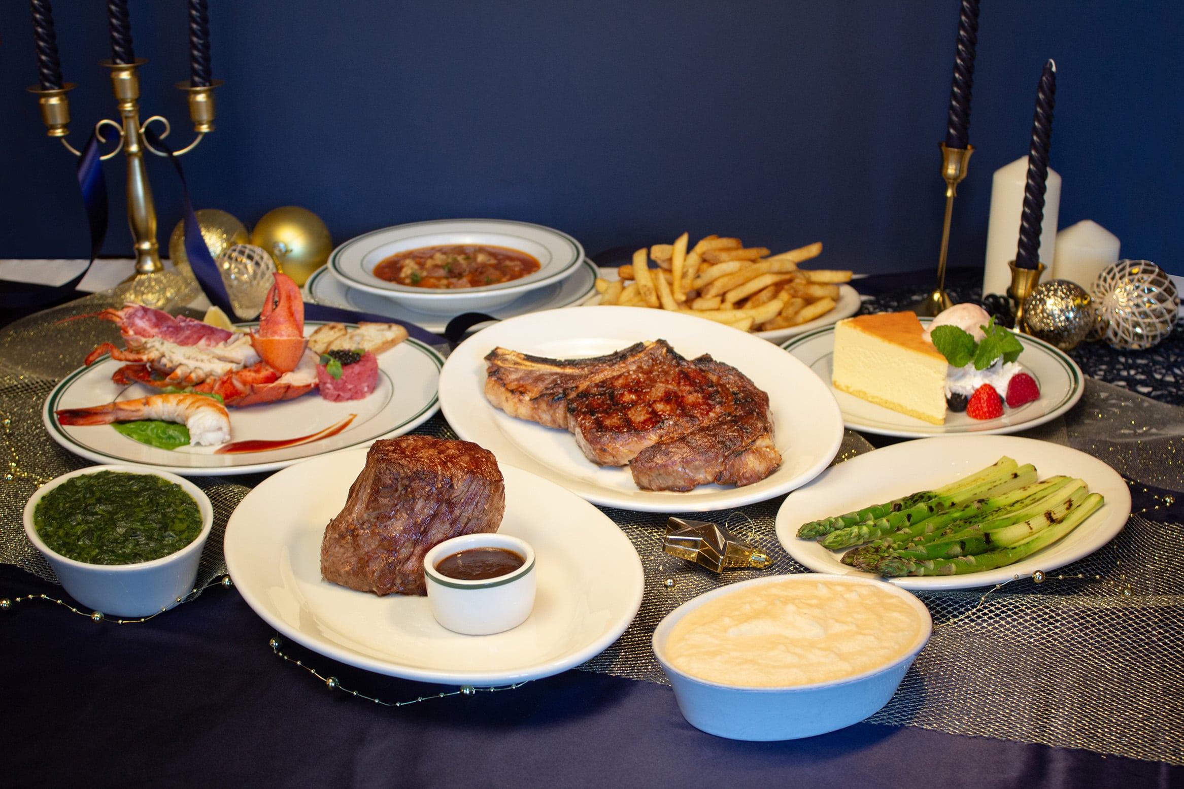 Wolfgang’s Steakhouse Singapore Christmas 2025 four-course festive set menu featuring USDA Prime Ribeye, Filet Mignon, seafood platter, grilled asparagus, mashed potatoes, and New York cheesecake — ideal for upscale corporate Christmas dinners in Singapore.