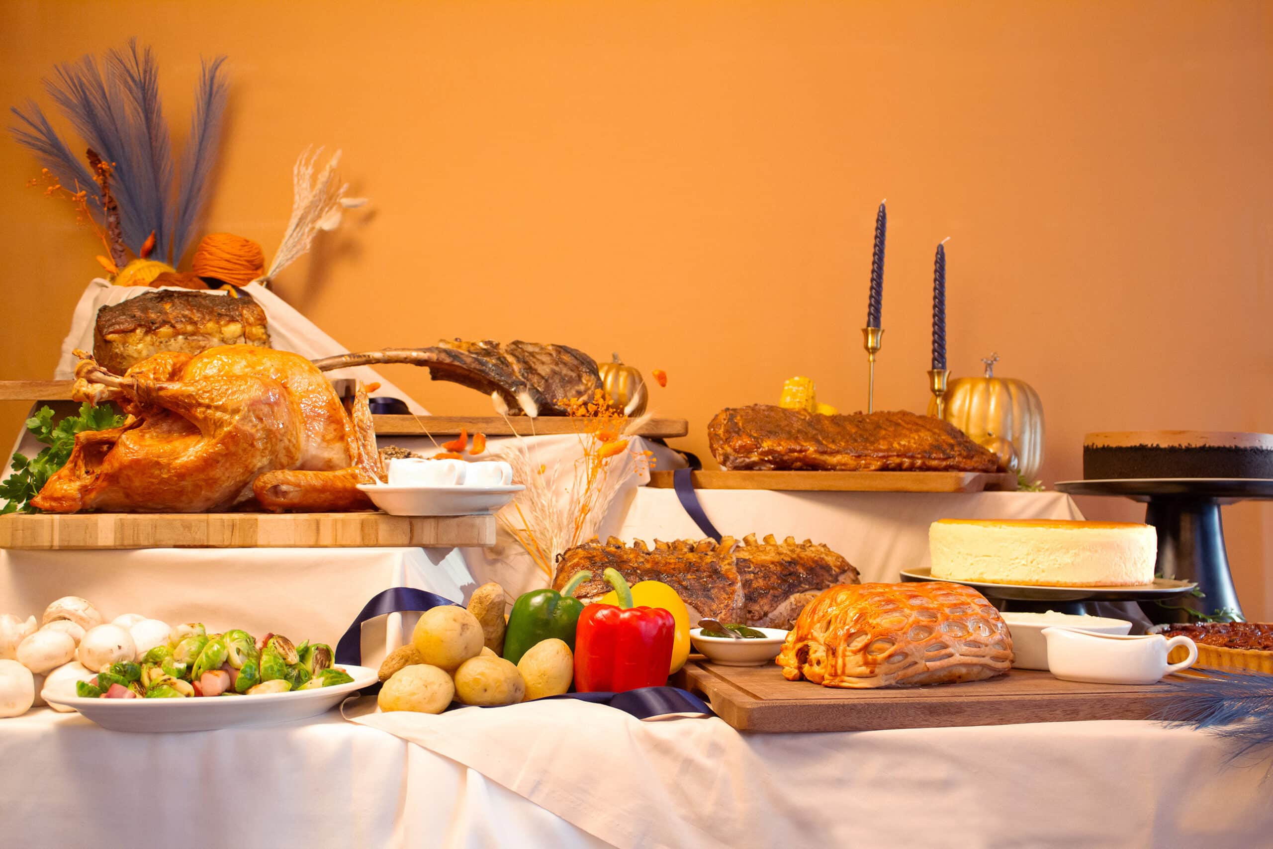 Wolfgang’s Steakhouse Singapore festive prime rib roast sliced and served with jus, vegetables, and Christmas table décor, ideal for takeaway celebrations.