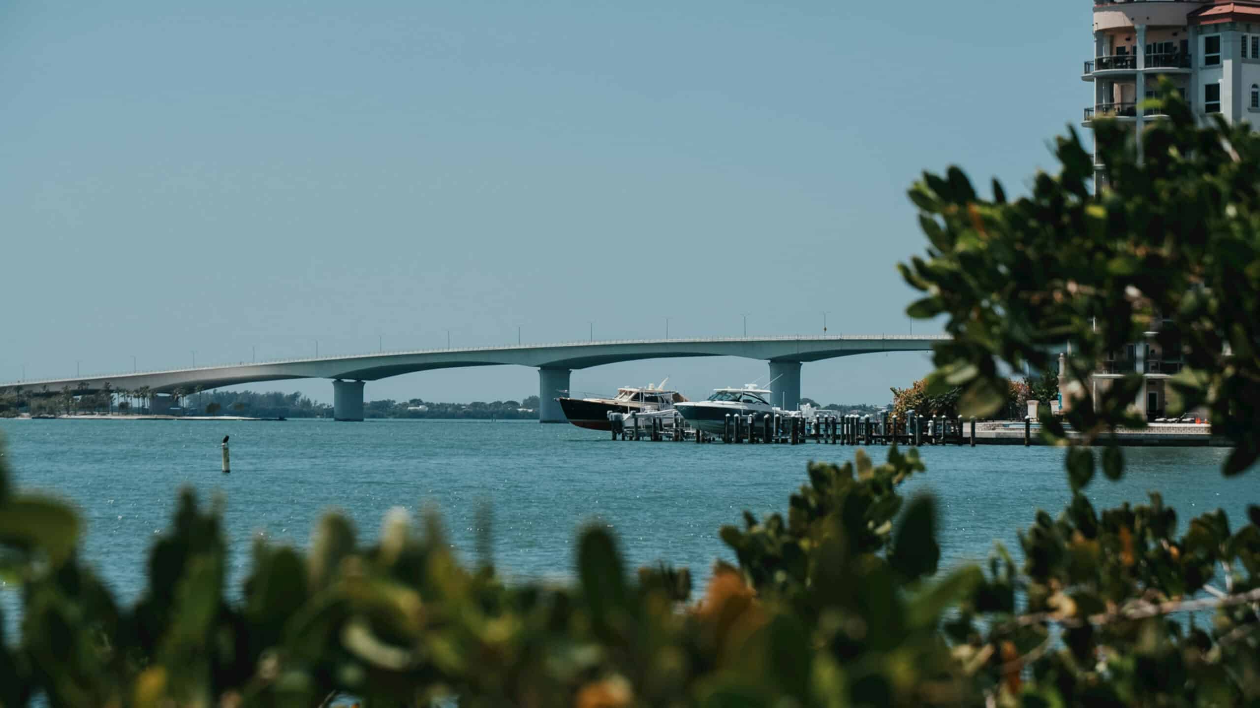 Scenic wooden bridge over water at a Florida campground, capturing tranquil views near luxury cabins with air conditioning and modern comforts.