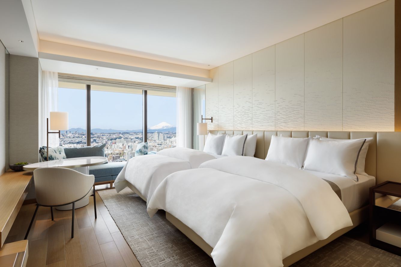 Spacious twin room at The Westin Yokohama with floor-to-ceiling windows, Mt. Fuji views, and serene minimalist design—luxury accommodation in a top Yokohama hotel.