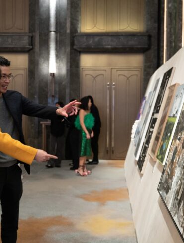 Guests engaging with contemporary artworks at Para Site’s 2025 Benefit Auction in Hong Kong, highlighting community connection and collector interest in emerging Asian artists.